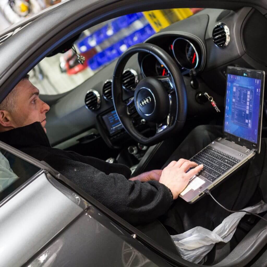 mechanic performing a remap on an Audi