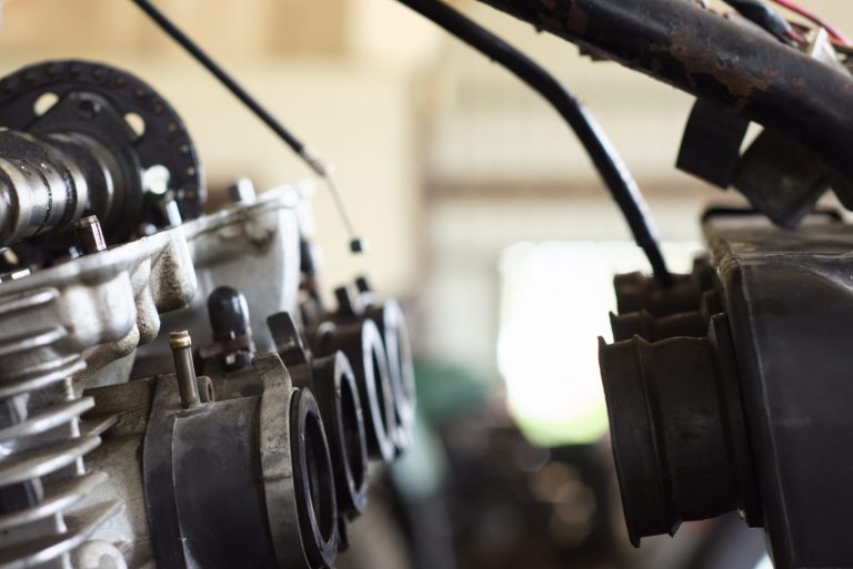 How can E10 fuel cause problems for my bike?